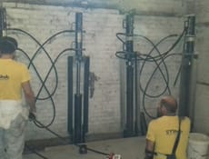 Pali Precaricati in acciaio: la soluzione per consolidare le fondazioni di un condominio di 5 piani in zona densamente abitata 