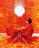 Marianne Panton seated on the Panton Chair, 1970 - © Verner Panton Design AG - photo Louis Schnakenburg, Copenhagen