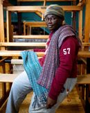 Berea College Student Craft, Leeroy Mabvuta with Symphony Scarves. Cotton, bamboo, tensel; 80 x 11 inches. Photo: Sean Hall