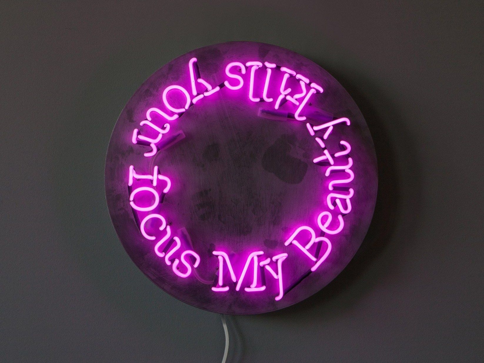Wallmounted neon light installation BEAUTY By sygns