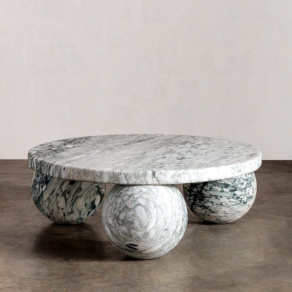 MORRO Round natural stone coffee table By Kelly Wearstler