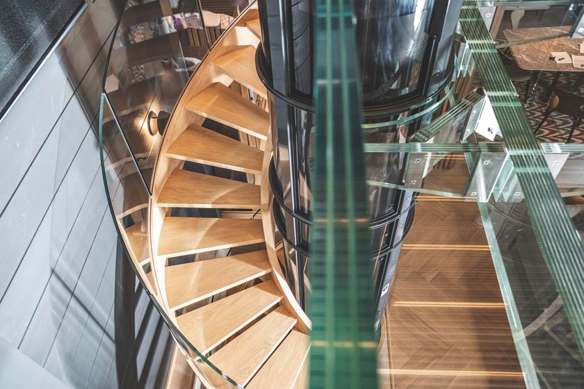 Wood and glass Open staircase with lateral stringers HELICAL STAIRCASE ...