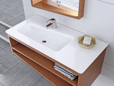 Rectangular wall-mounted tempered glass washbasin with integrated countertop SKEW BISELARTE