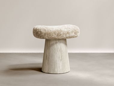Low oak stool with seat upholstered in shorn shearling wool ARTISAN Paloma Editions