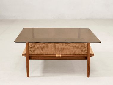 Wood and glass central coffee table TANGĀLI Phantom Hands