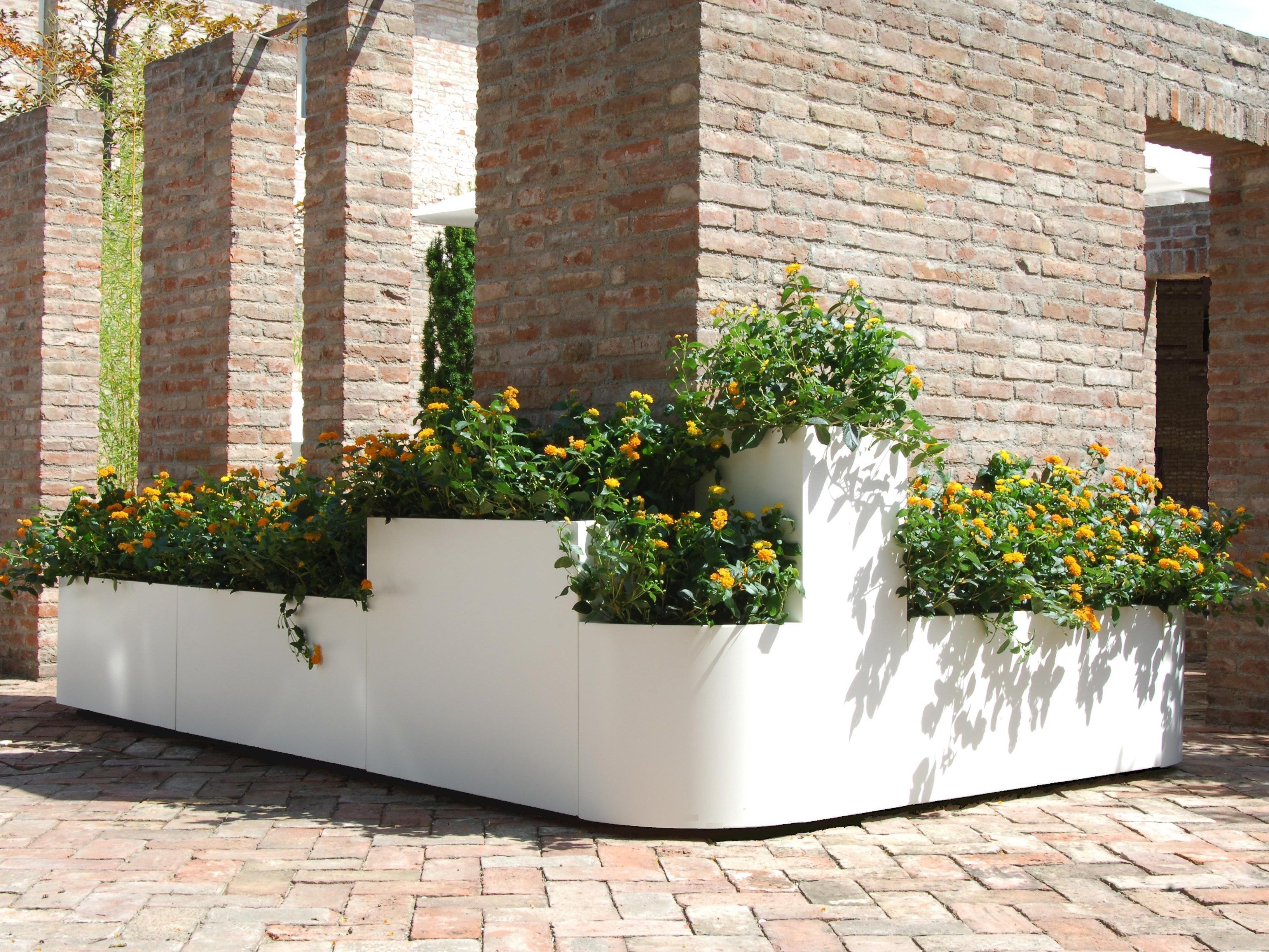 A Modular stainless steel planter By BLOSS
