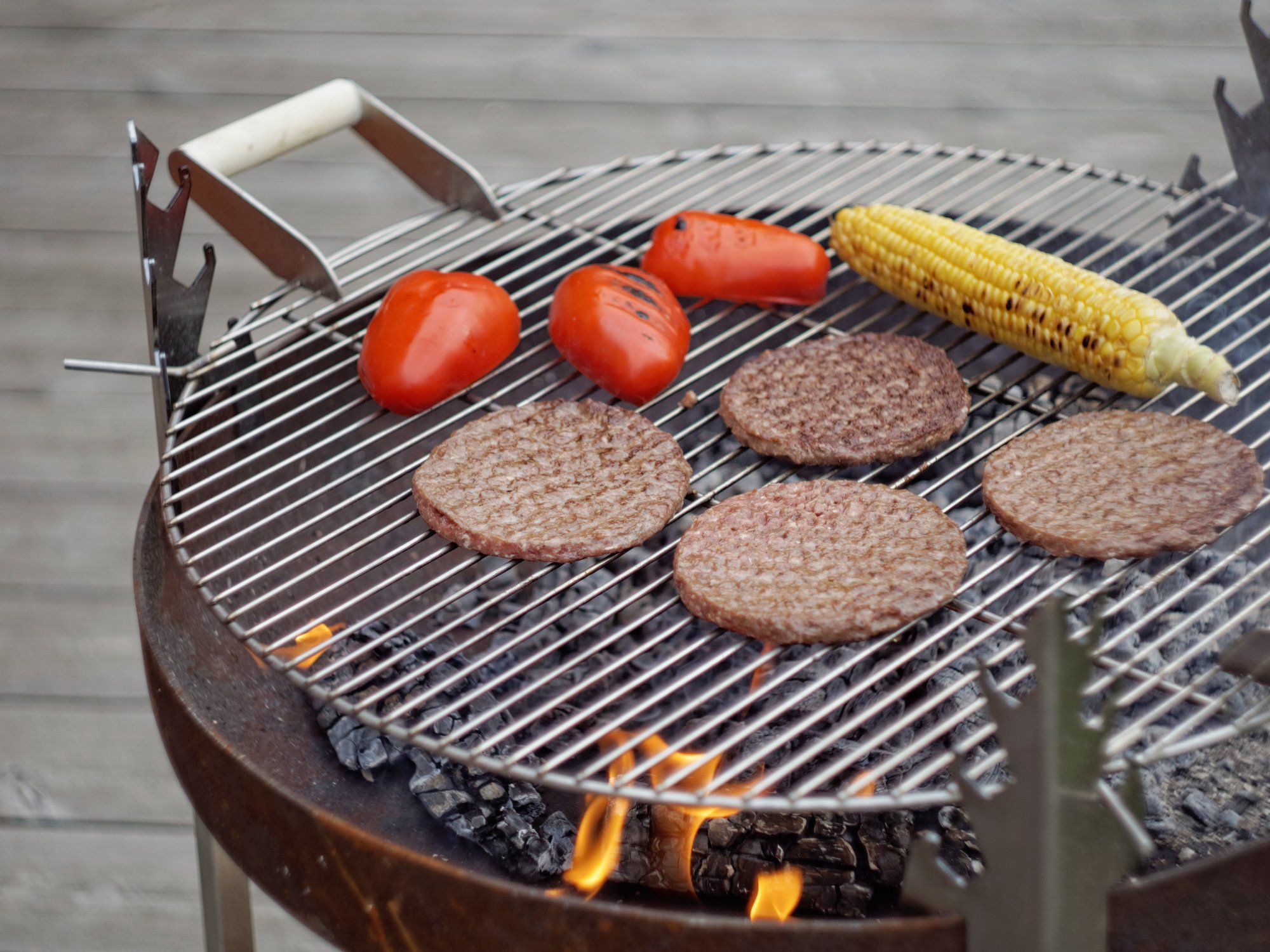 Stainless steel grates with wood handles HANGING BBQ By Arpe studio