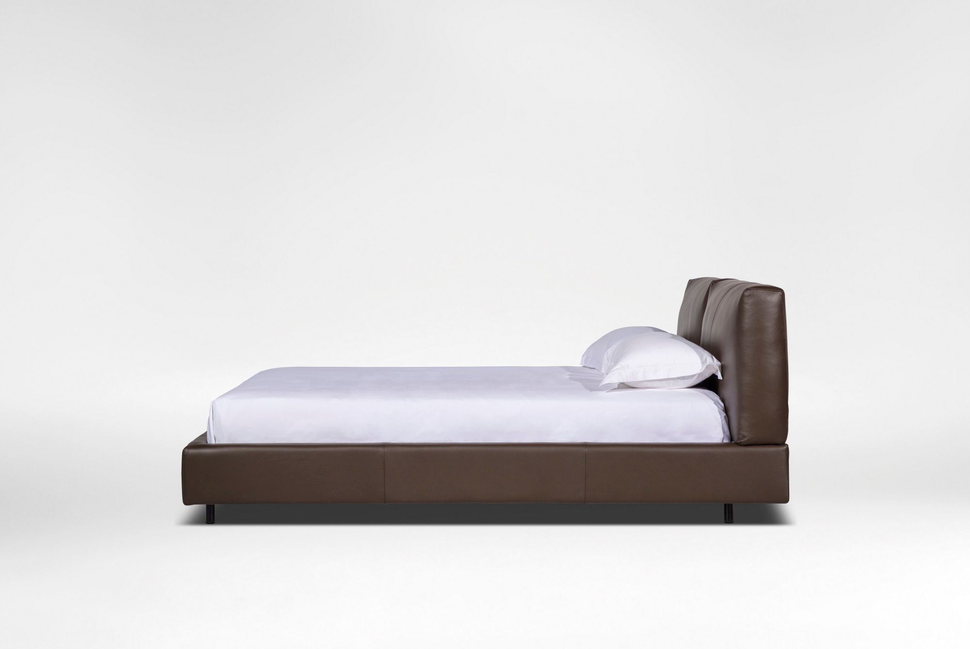 NATURE Heightadjustable leather bed with upholstered headboard By CAMERICH